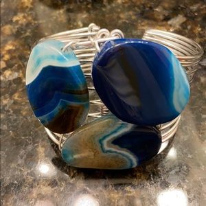 Bangle with 3 blue precious stones